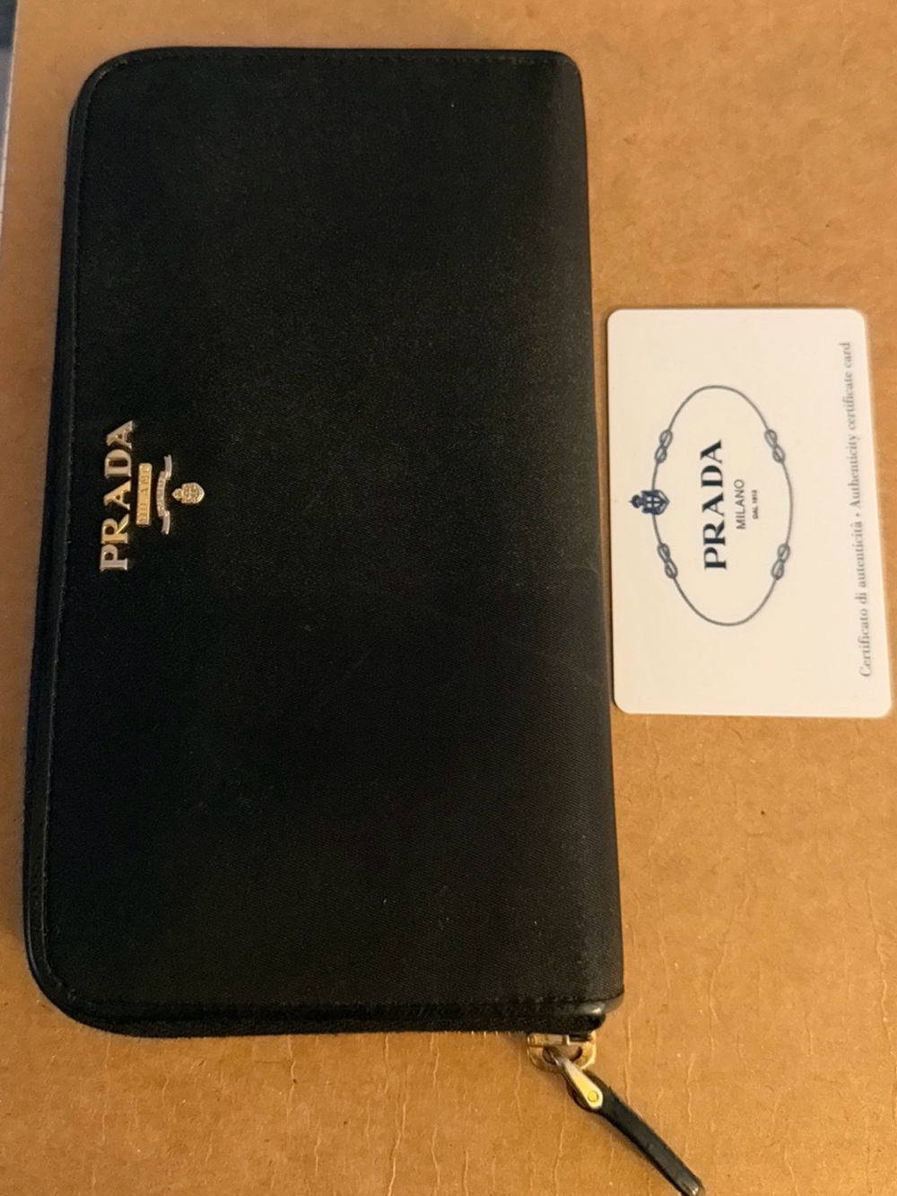 Prada Tessuto Nylon Zip-Around Wallet featuring gold-tone hardware and the raise